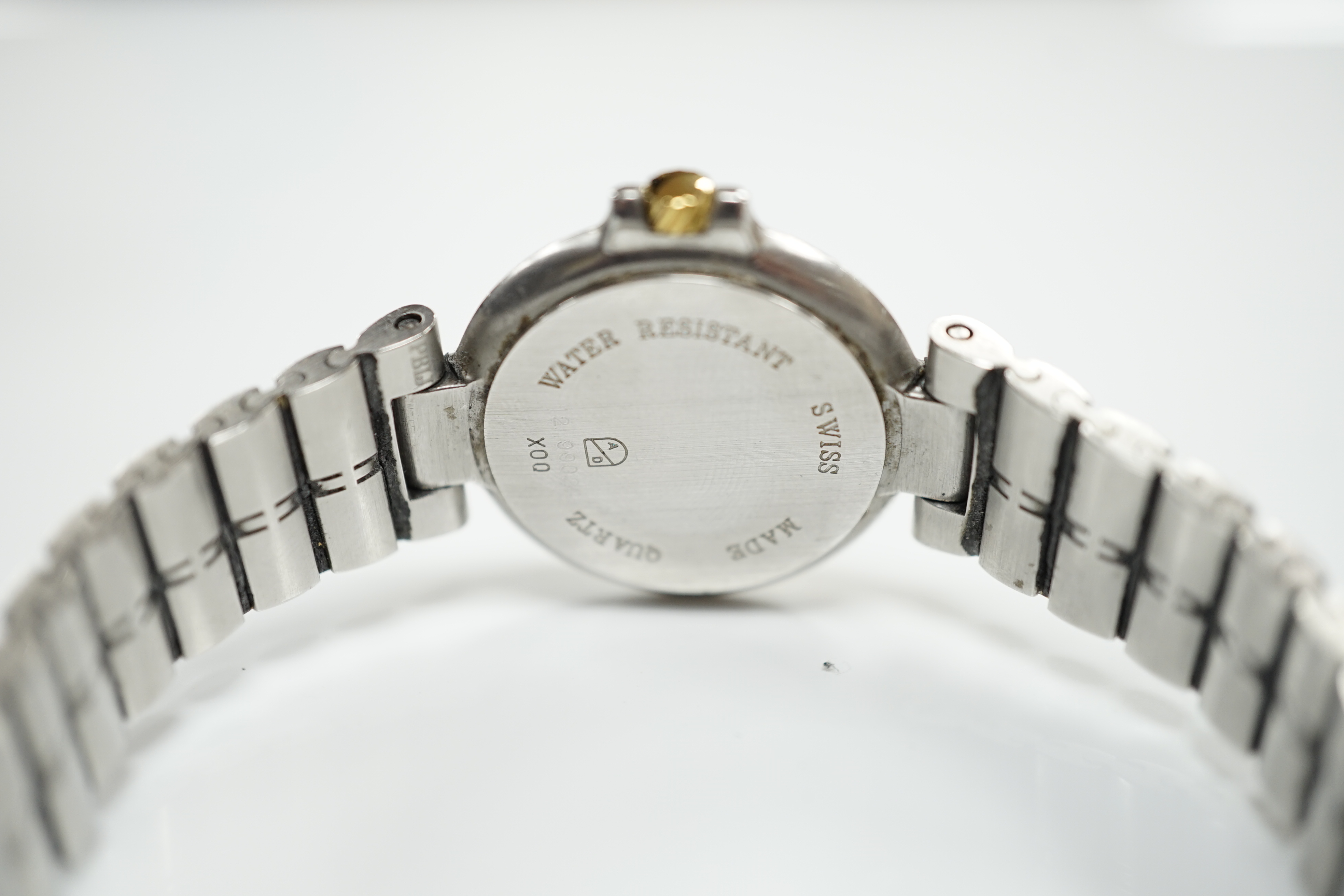 A lady's 1970's stainless steel Dunhill quartz wrist watch, with centre seconds and date aperture with box and papers.